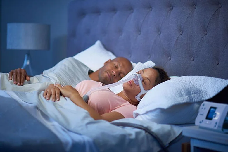healthcare-professionals-sleep-apnea-treatment-options-sleeping-with-cpap-mask.jpg