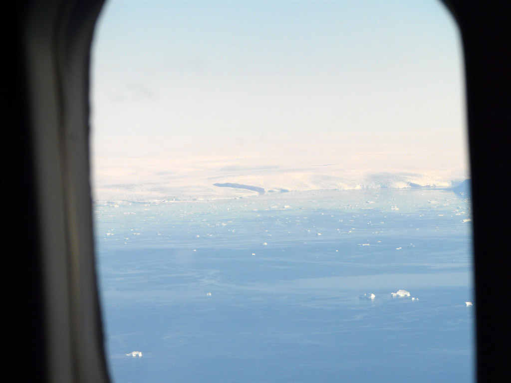 flying north toward Qaanaaq, the Greenland icecap spills directly into Melville Bay