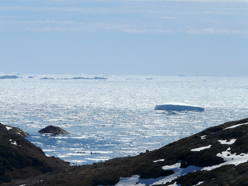 hiking in the hills above town, looking east over the icy seas toward Iceland