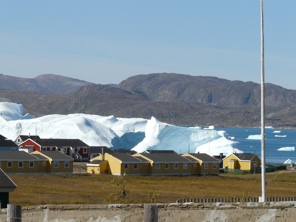 massive icebergs passing by the town