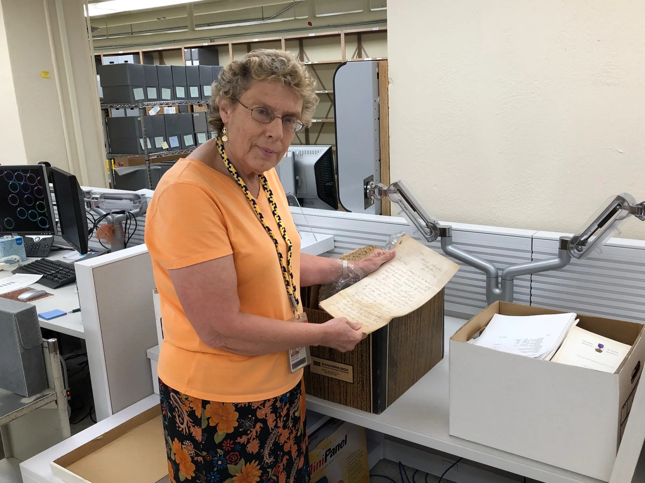 Christine Weideman, the Carrie S. Beinecke Director of Manuscripts and Archives, examines a piece of early correspondence from the National Institute’s donation to Yale.