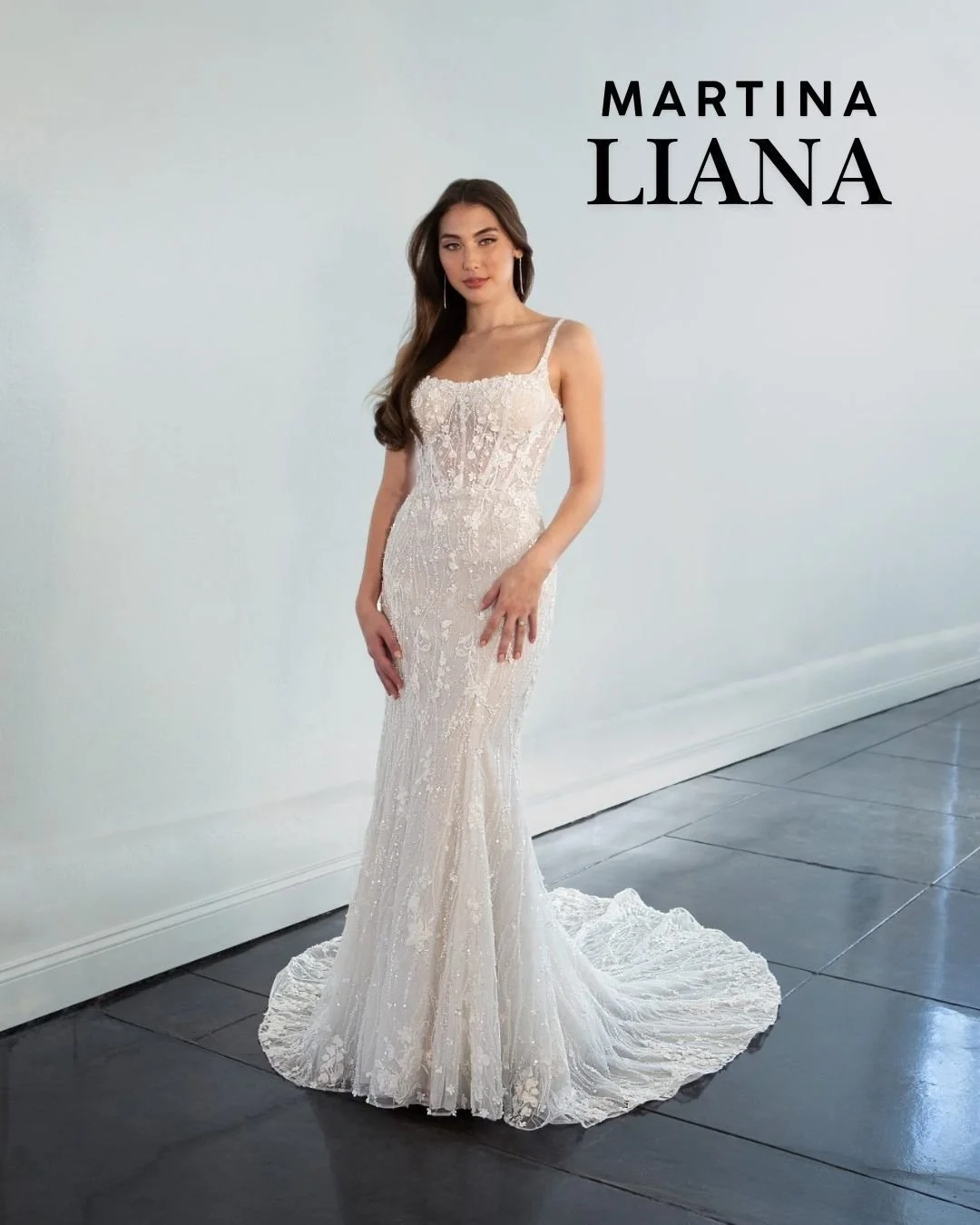 Come into our Kingston Studio to try on our curated collection of @martinalianabridal gowns. 

1510 pictured which is covered in 3D floral embellishments and strands of elegant beading a semi-sheer bodice with exposed boning tapers the waist with its