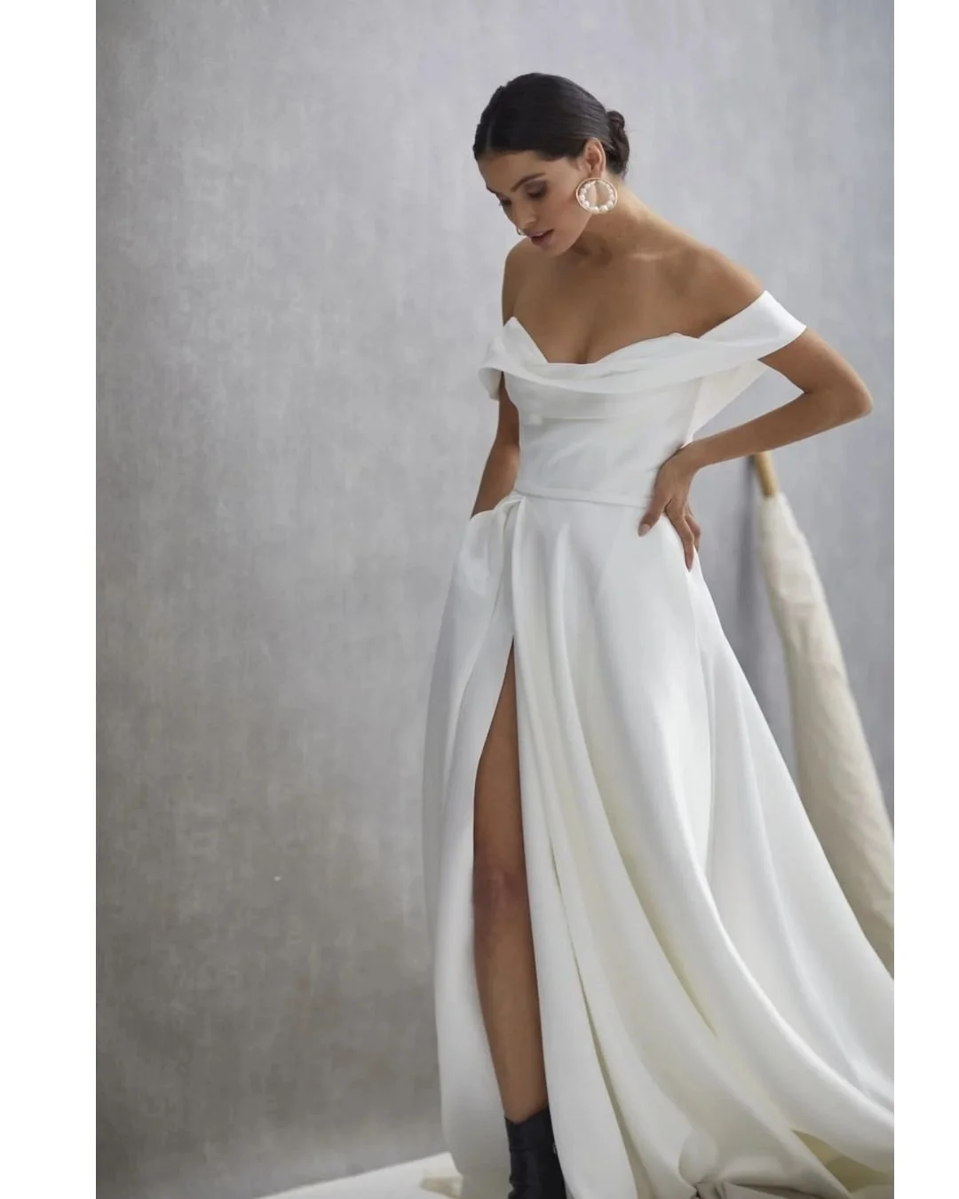 LE BELLE V2 from @Heracouture designed for the cool girl bride. 
Beautiful heavyweight silk drill satin, Le Belle V2 features a corseted bodice that meets a full A-line skirt, while a sculptured drop shoulder adds a modern twist to a sweetheart neckl