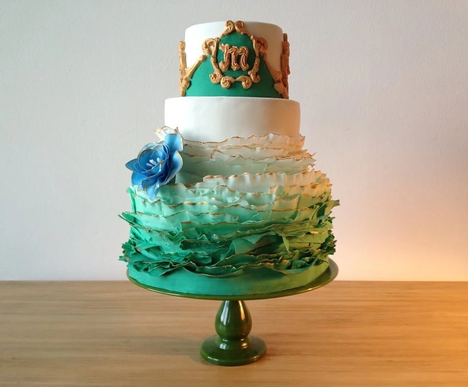 Fondant covered cake with gilded fondant ruffles
