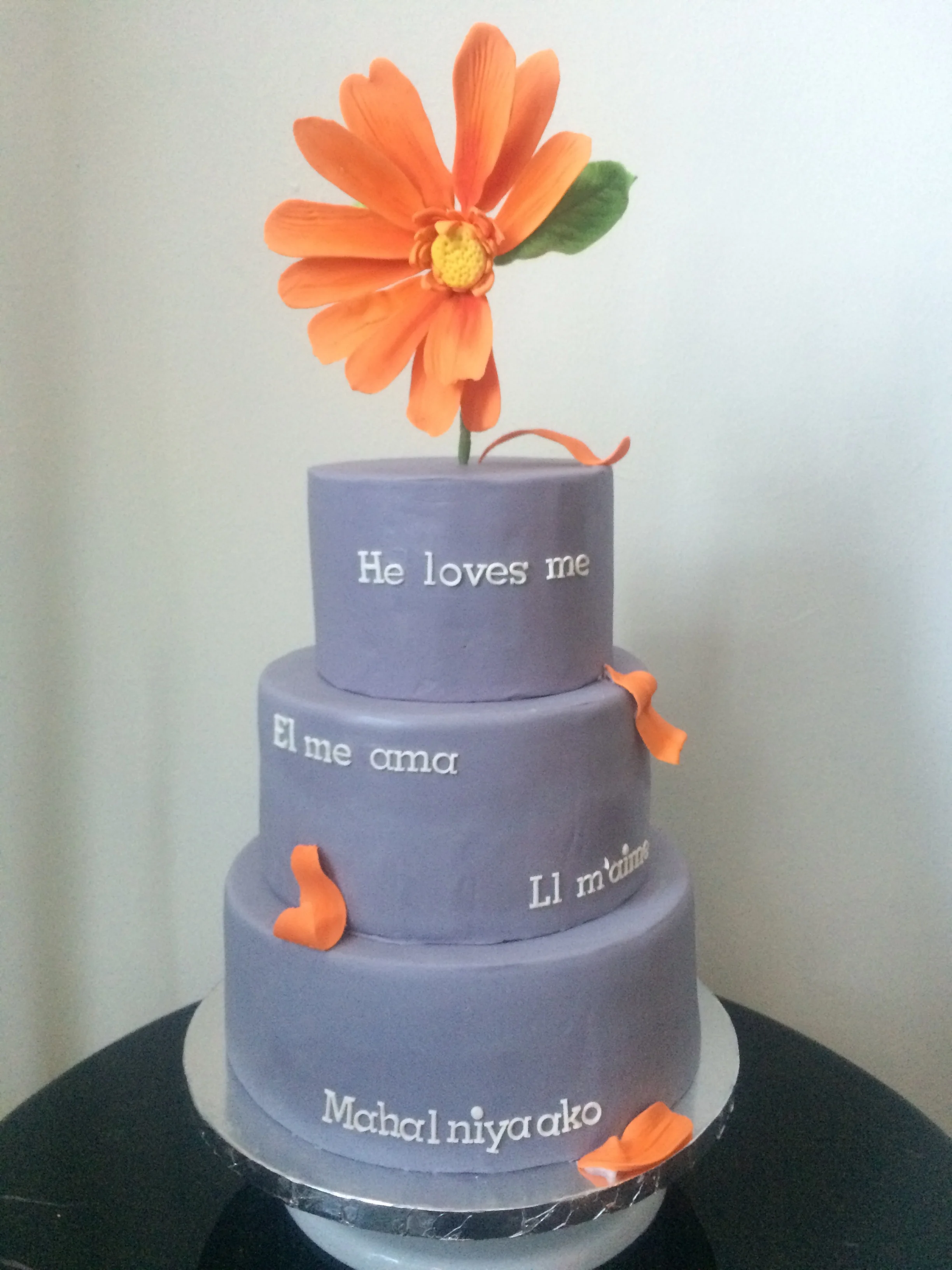 Forget-me-not cake with sugar paste writing and flower