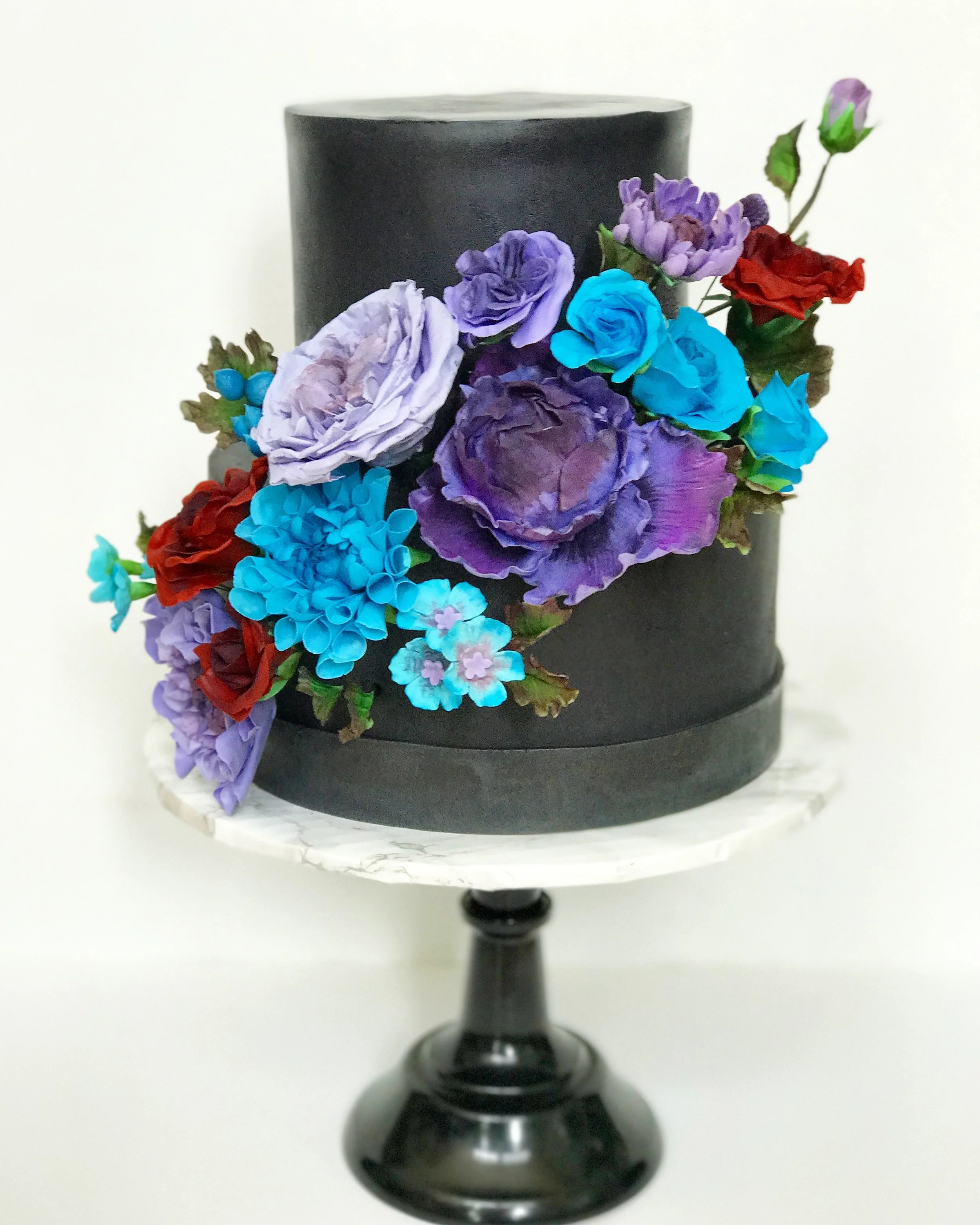 Chocolate fondant covered cake with sugar paste flowers