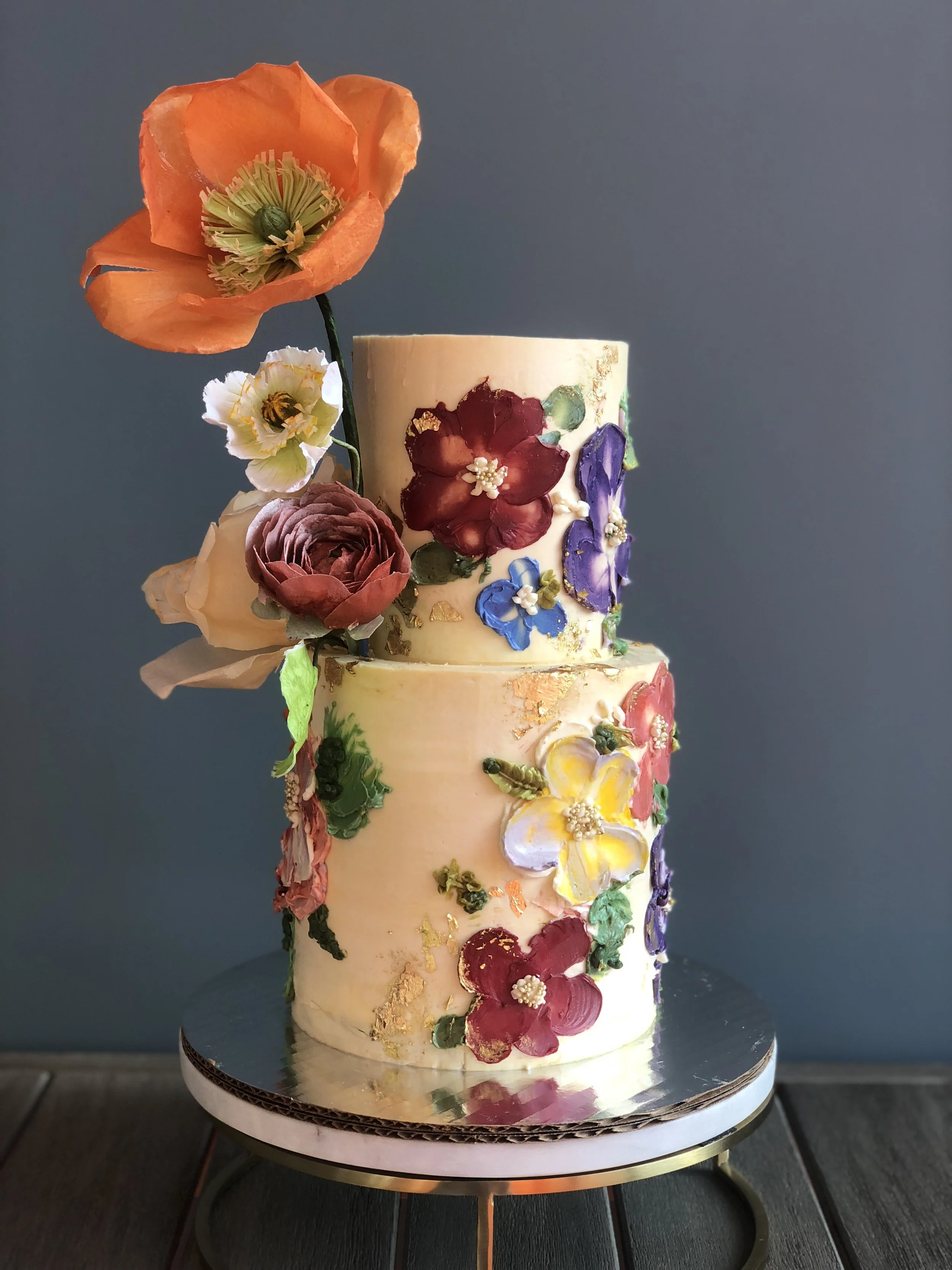 Painted buttercream floral cake with wafer flowers