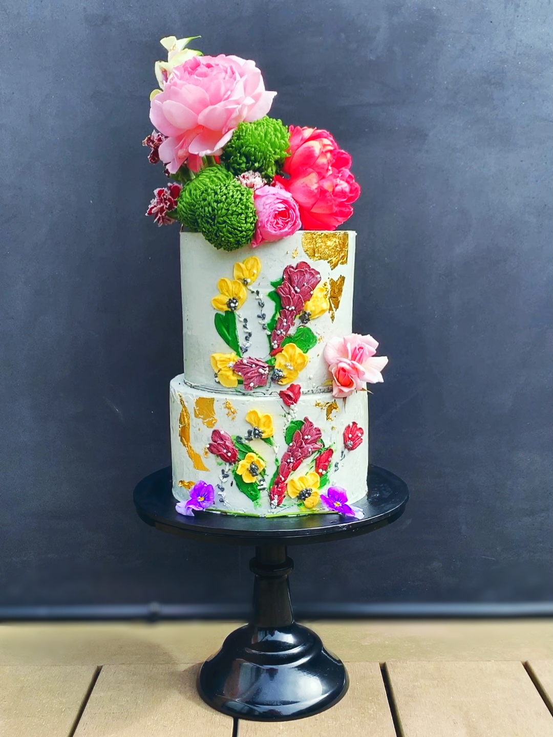 Concrete buttercream with hand piped florals and fresh florals