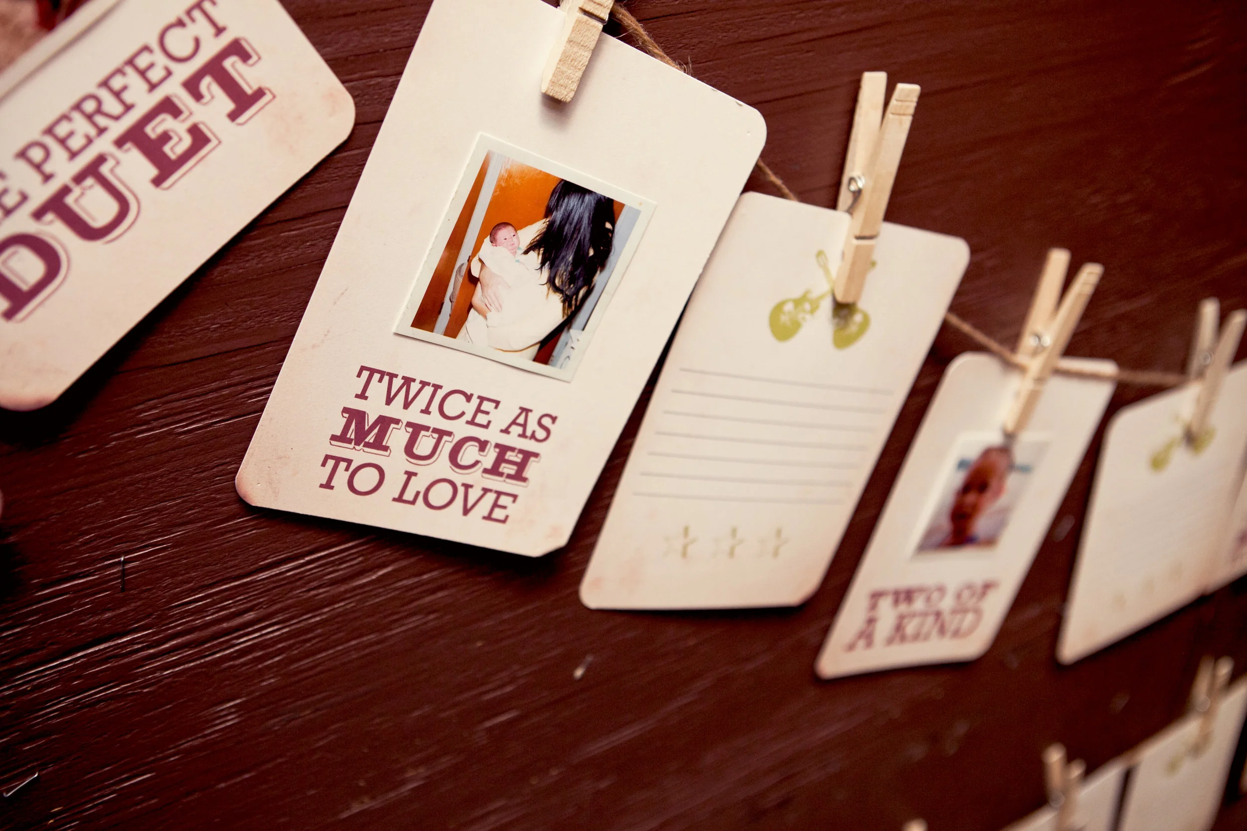 "Twice as Much to Love" and "Two of a Kind" to celebrate their upcoming twins' arrival.
