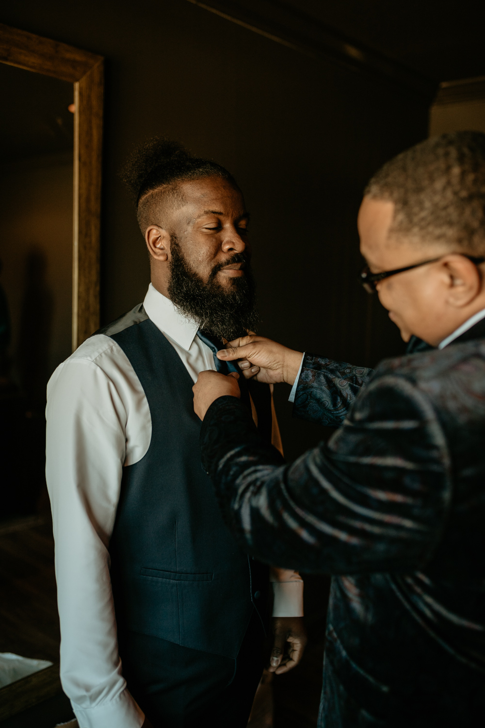 father fixing son's tie photo.jpg