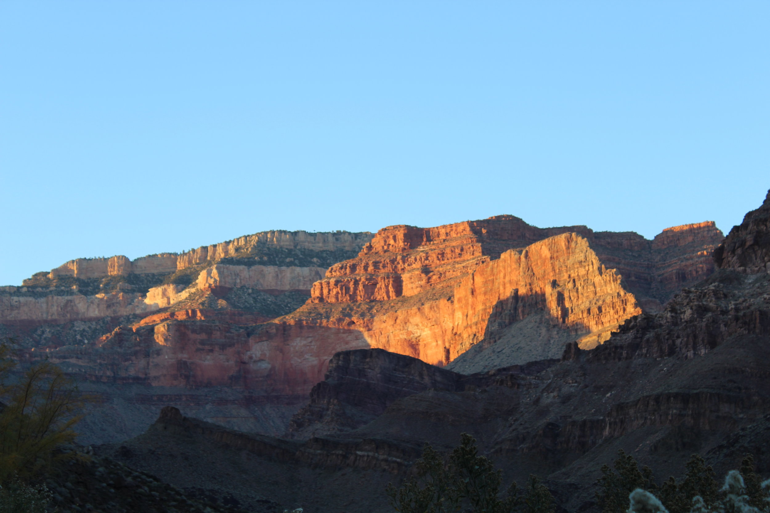 Sun sets on the upper walls of the north rim.