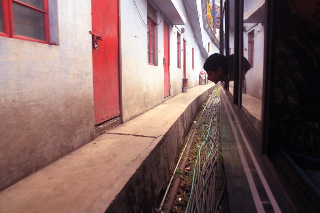 Watching the world through a train window on the way to your native place. Darjeeling.