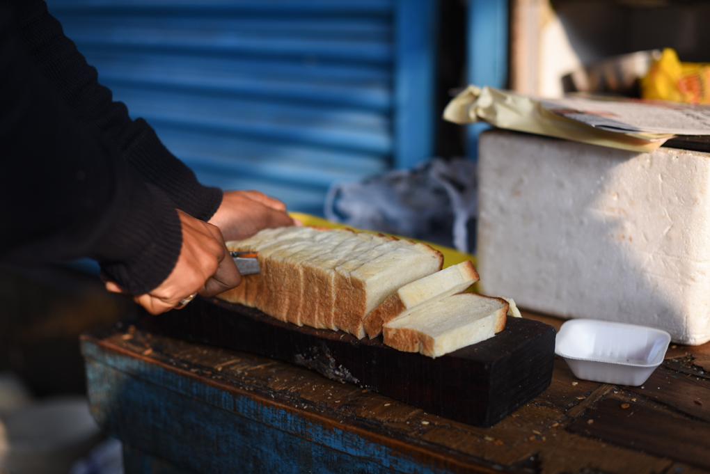 Freshly baked bread is sliced, toasted, buttered and sprinkled with sugar, to be dipped in chai and devoured. 