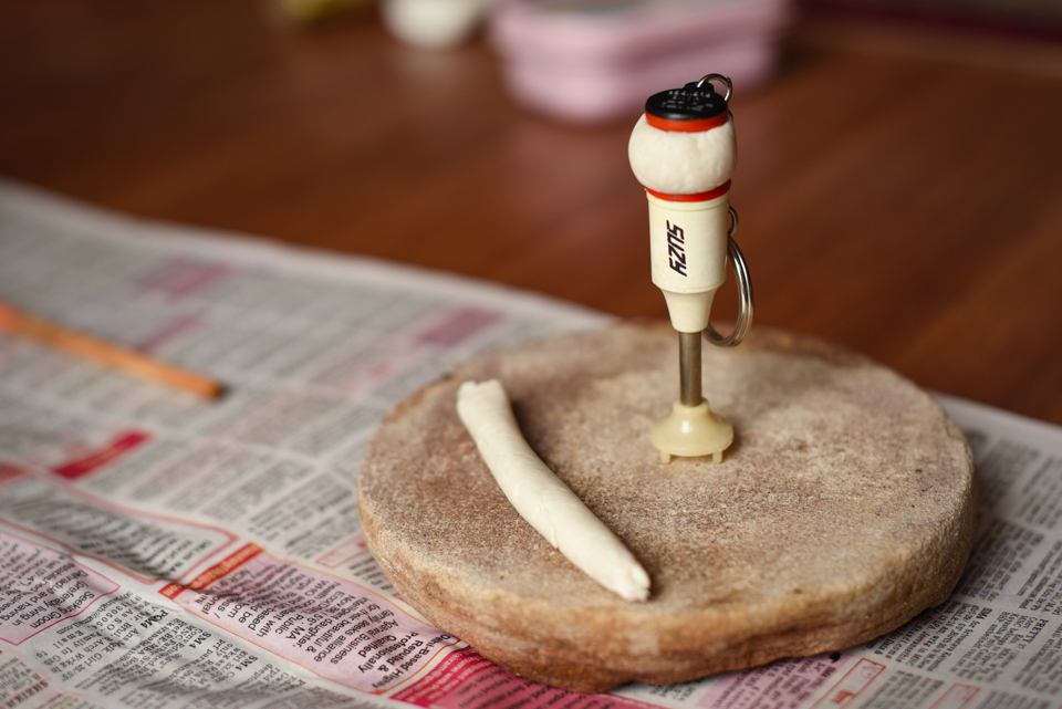 Miniature hand blender keychains found in decades worth of hoarded material, with which we made dolls for Gangaur .