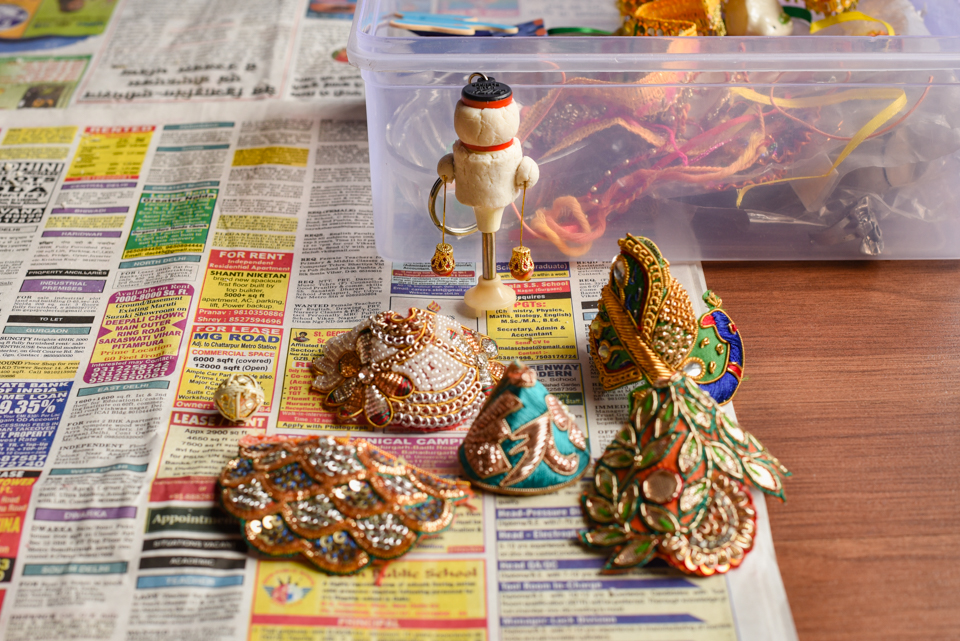 Once a base made of bread and glue was in place, we rummaged through old rakhis to make pretty little outfits.