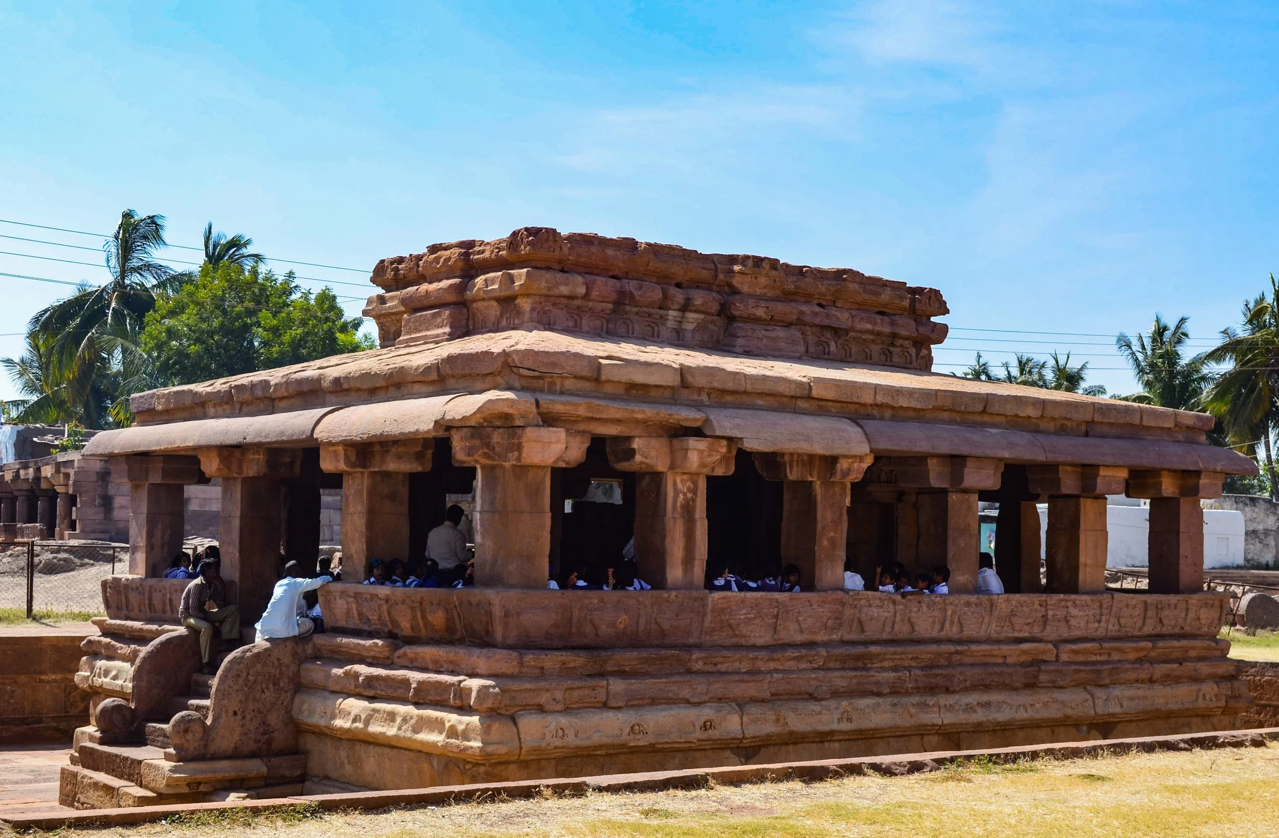 Aihole, November 2017. In the mid-morning heat, the kids sat protected inside.