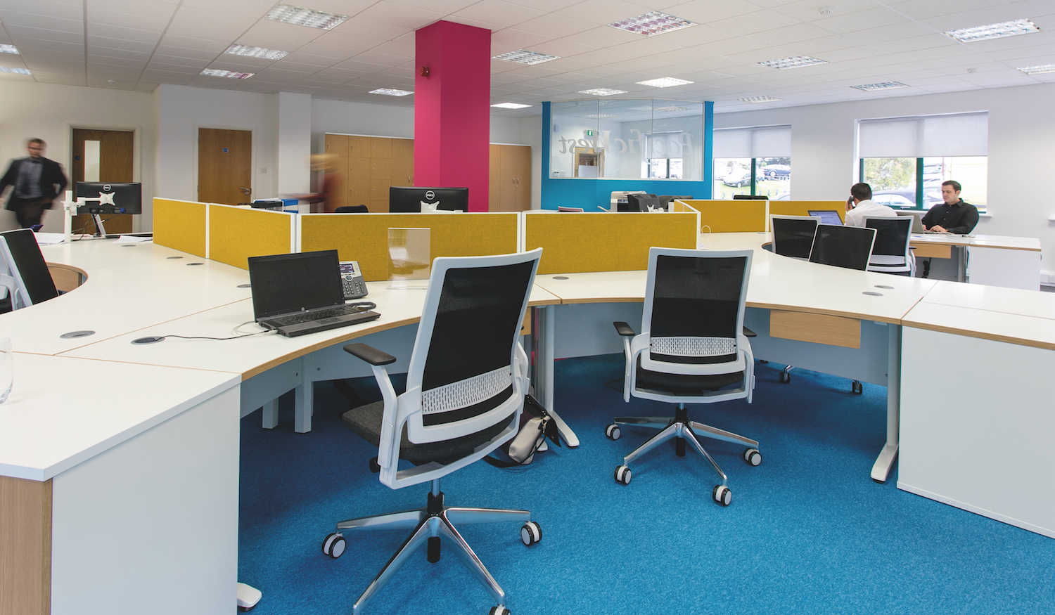 120 degree white desking with oak edging on white cantilever steel legs.