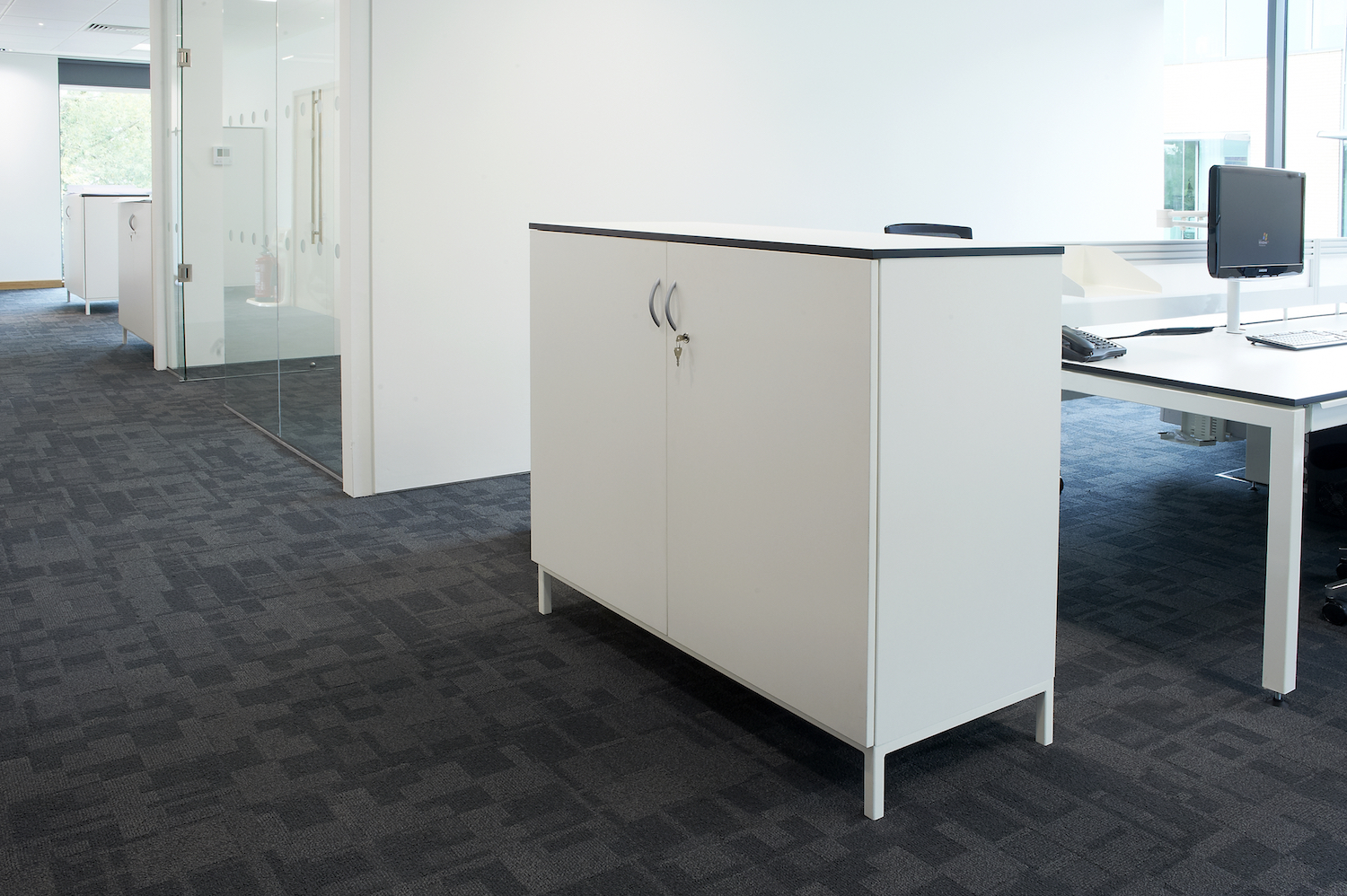 Under lit raised storage units in white mfc with black contrast edging