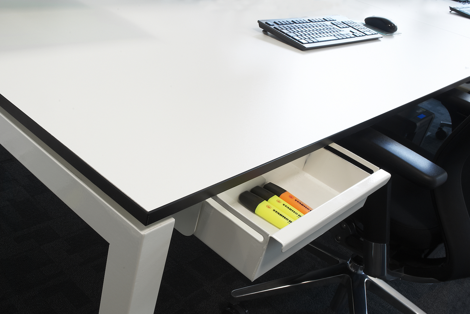 White D50 Bench Desk featuring black contrast edged 18mm top and bespoke integrated pen trays.