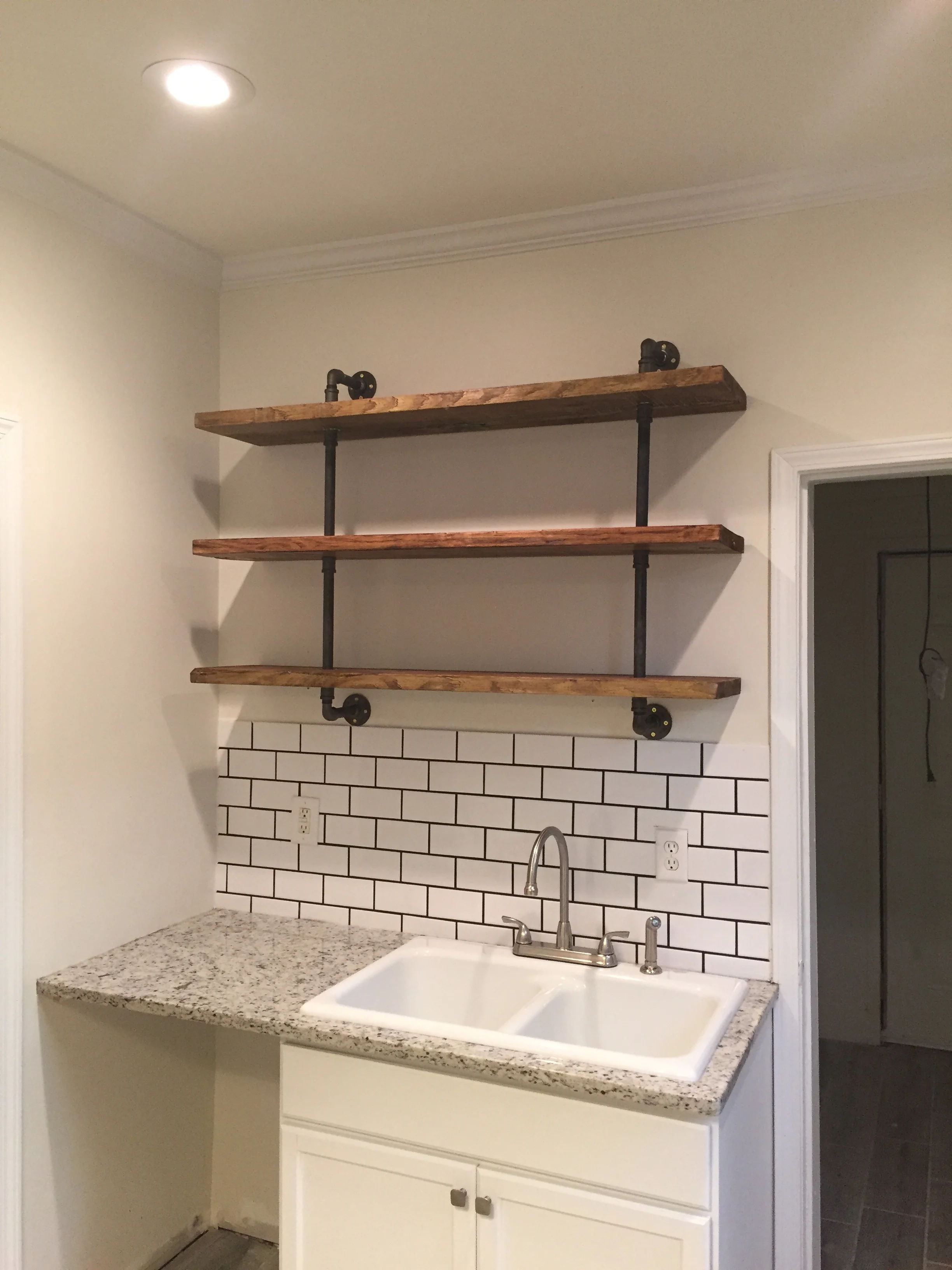 Custom Pipe Shelving in ATL Air BNB