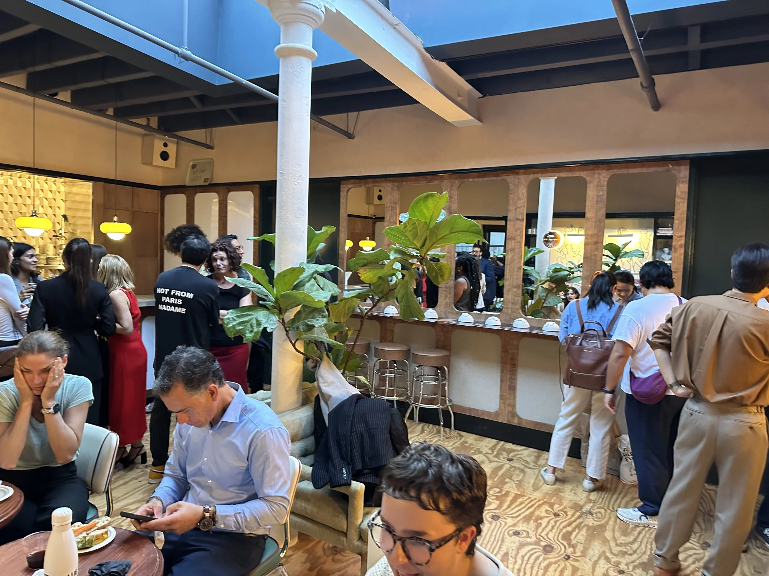 Obama Leadership Network alumni interacting with the installation, sharing stories of their climate action with one another.