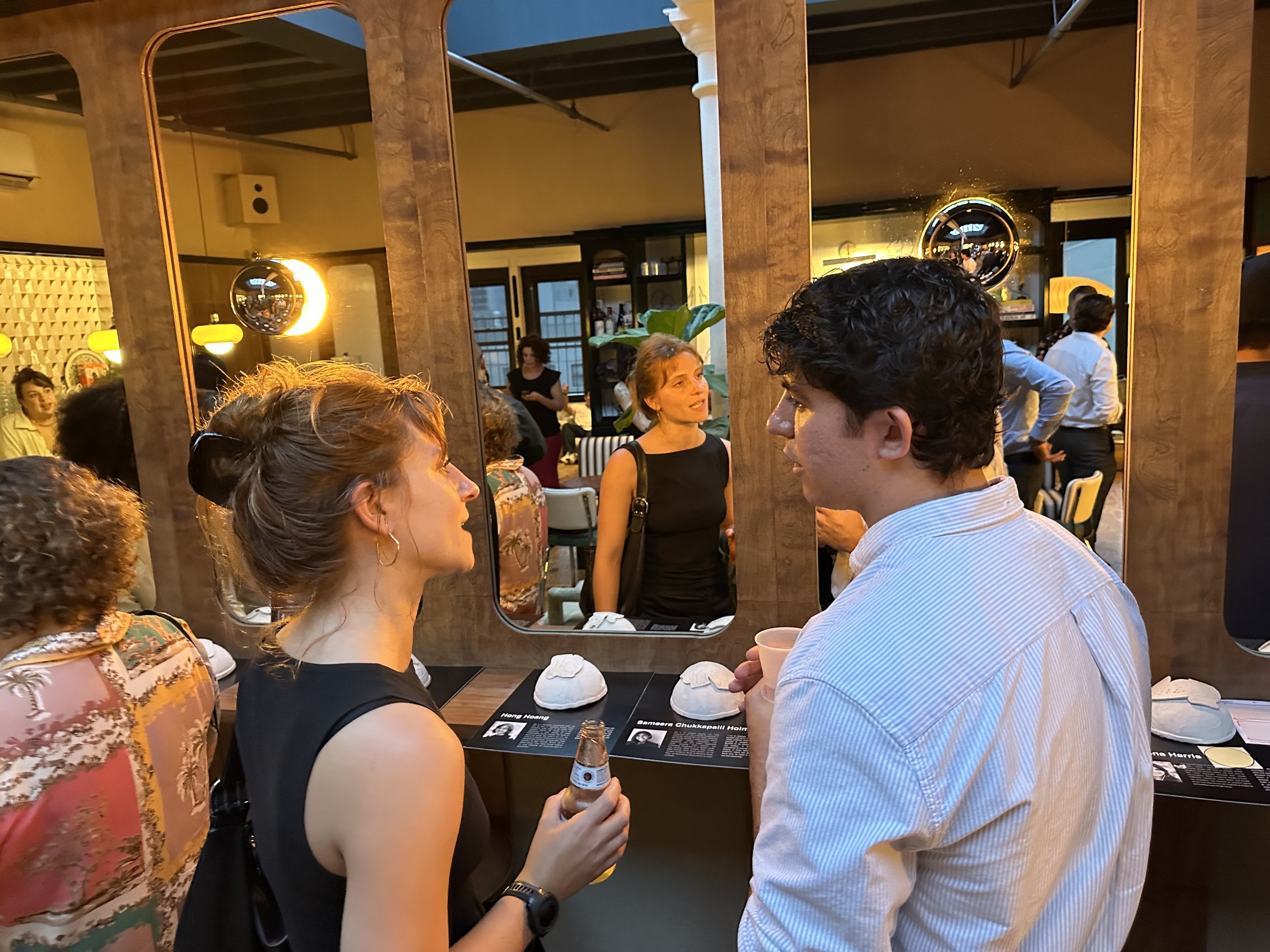 Obama Leadership Network alumni interacting with the installation, sharing stories of their climate action with one another.