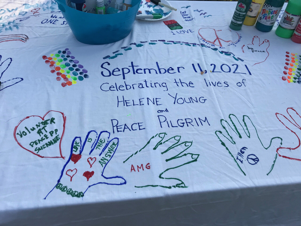  Handprints for peace cover the celebration cloth.  