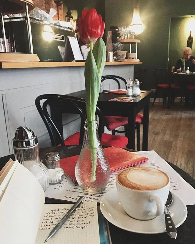 one single train of thought from Cafe de France: There are tulips on every table. Who&rsquo;s job is it to buy them? Do they enjoy the task or drag their feet to the flower shop? Who decided to place flowers in old Orangina bottles? Perhaps the owner