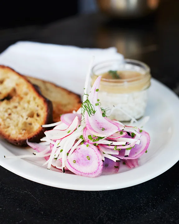 Our Smoked Salmon Mousse with pickled onions, crème fraiche, mustard seeds and grilled bread. 