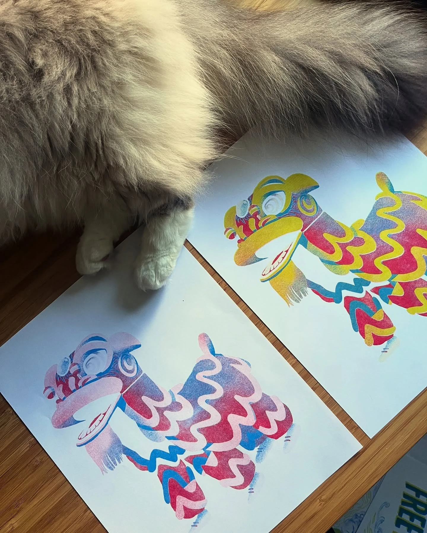 more riso test prints with Ivy! a hok san lion in cornflower, scarlet, and light lime 💖 
@veev_ho says she likes it better without the third light lime layer. what do you think? 🤔