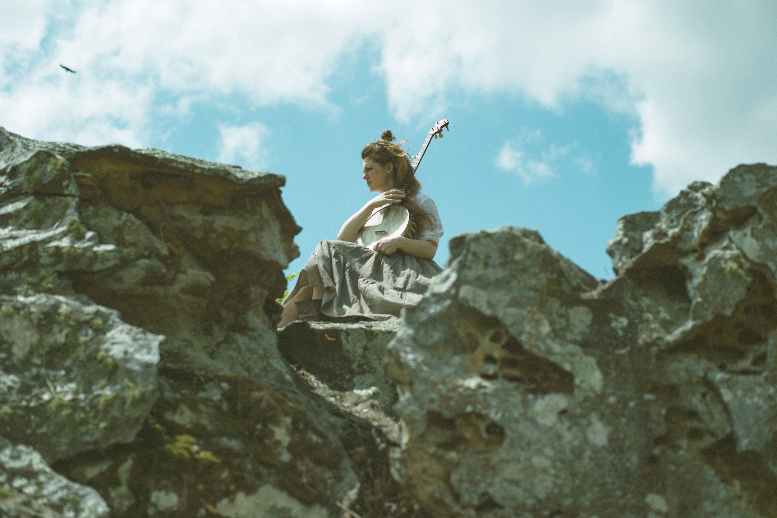 kelly on cliff with bird_edited.jpg