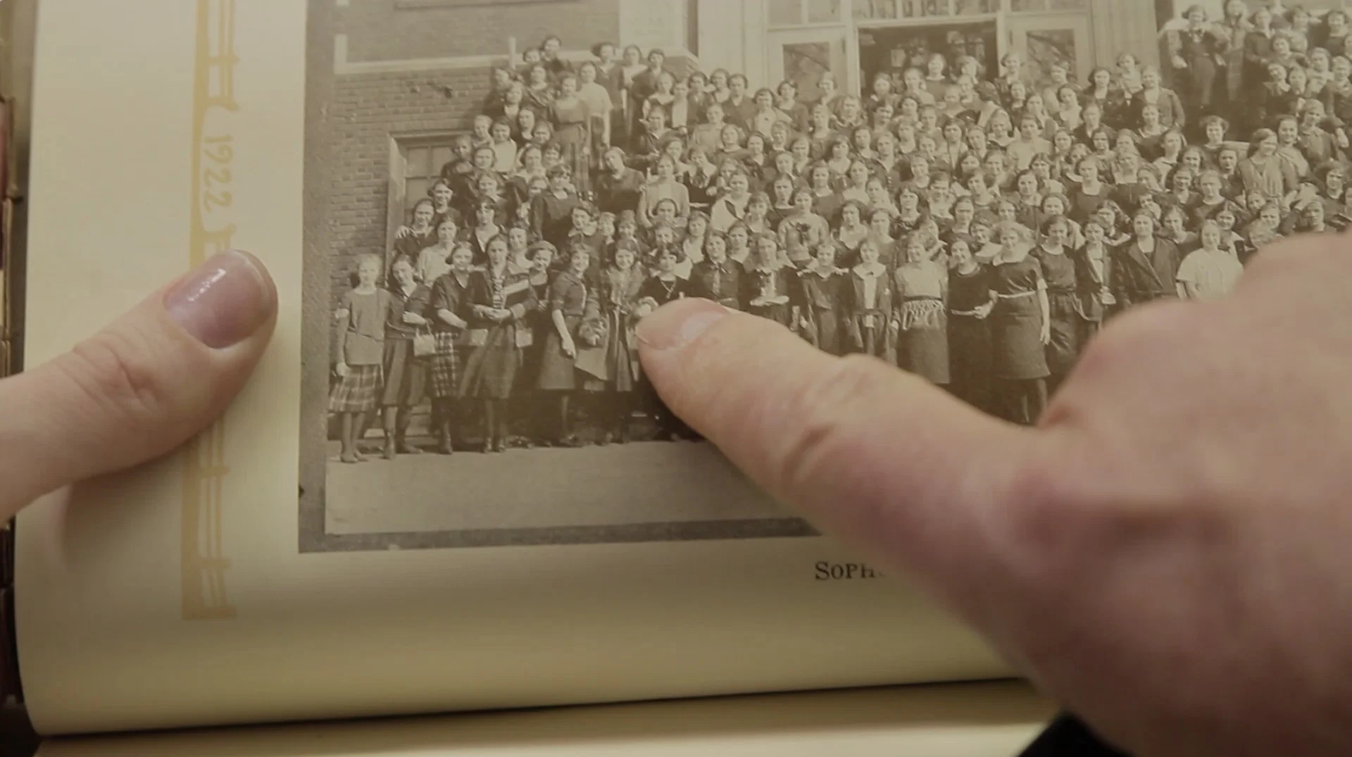 Stan is pointing at little Louise, who stands majestically in the front row in all black.