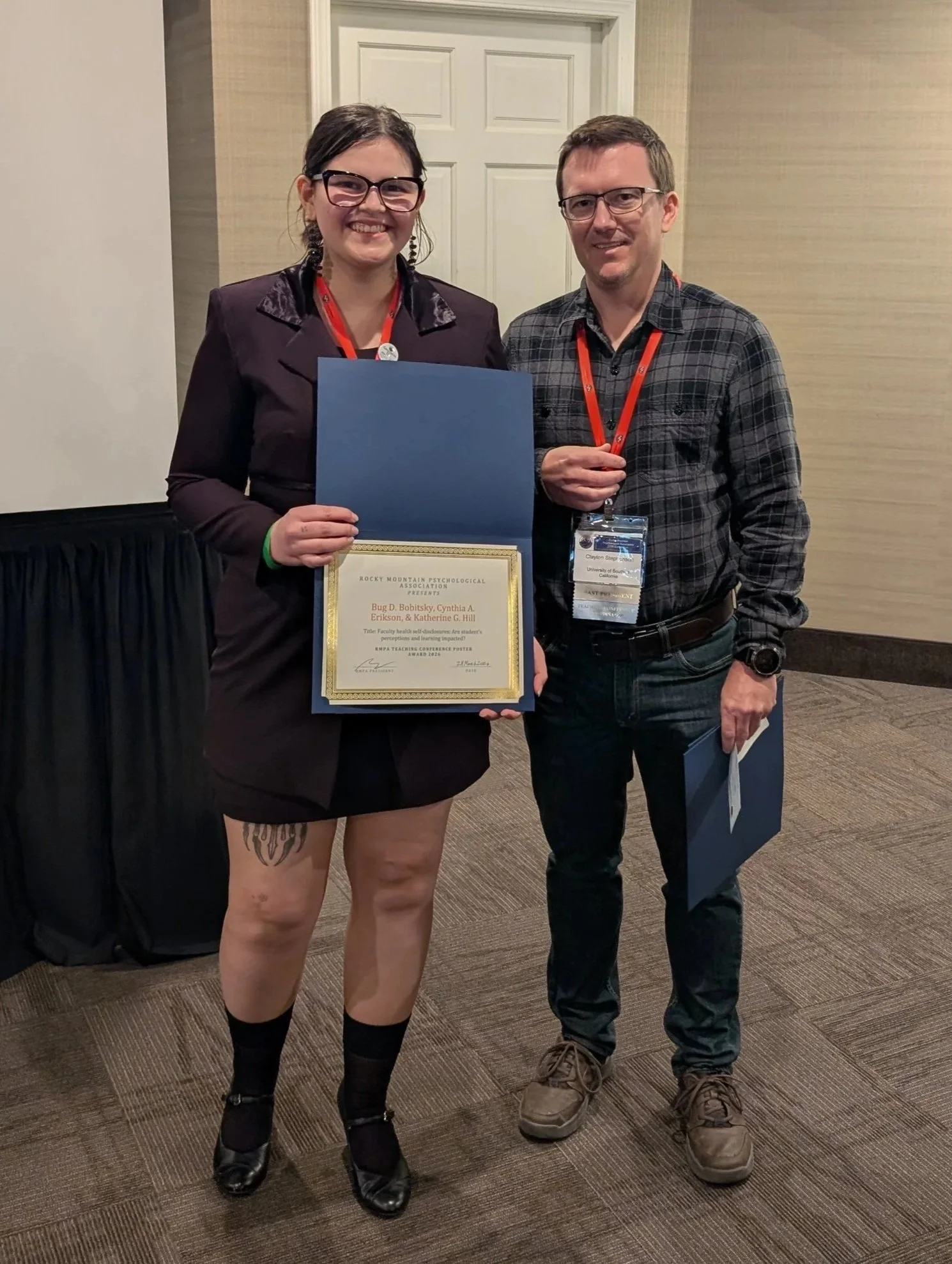 Bug Bobitsky, accepting the award from Clayton Stephenson. Both are smiling facing the camera, and Bug Bobitsky is holding up the certificate..