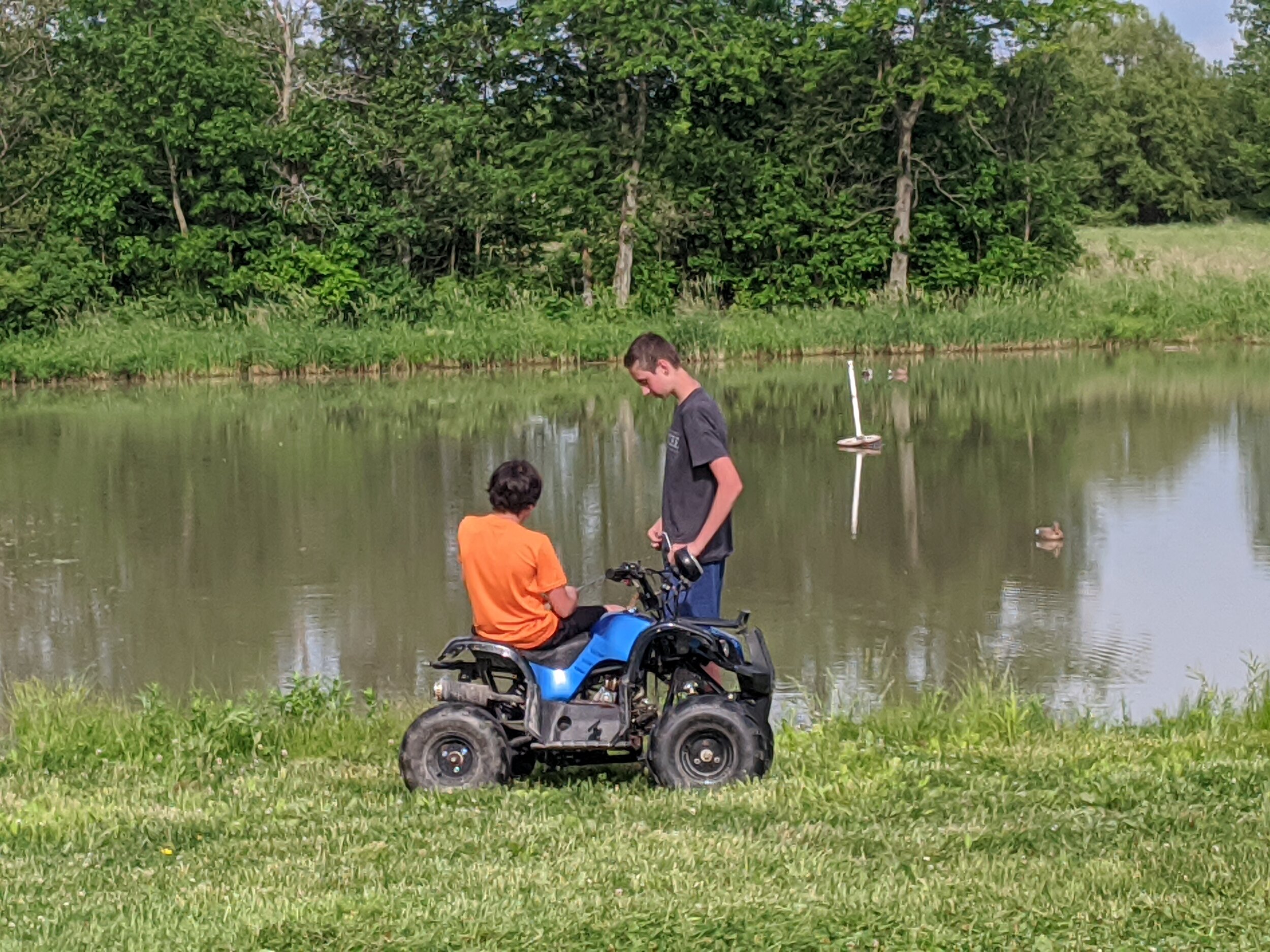 Guys Fishing and Visiting at the Pond