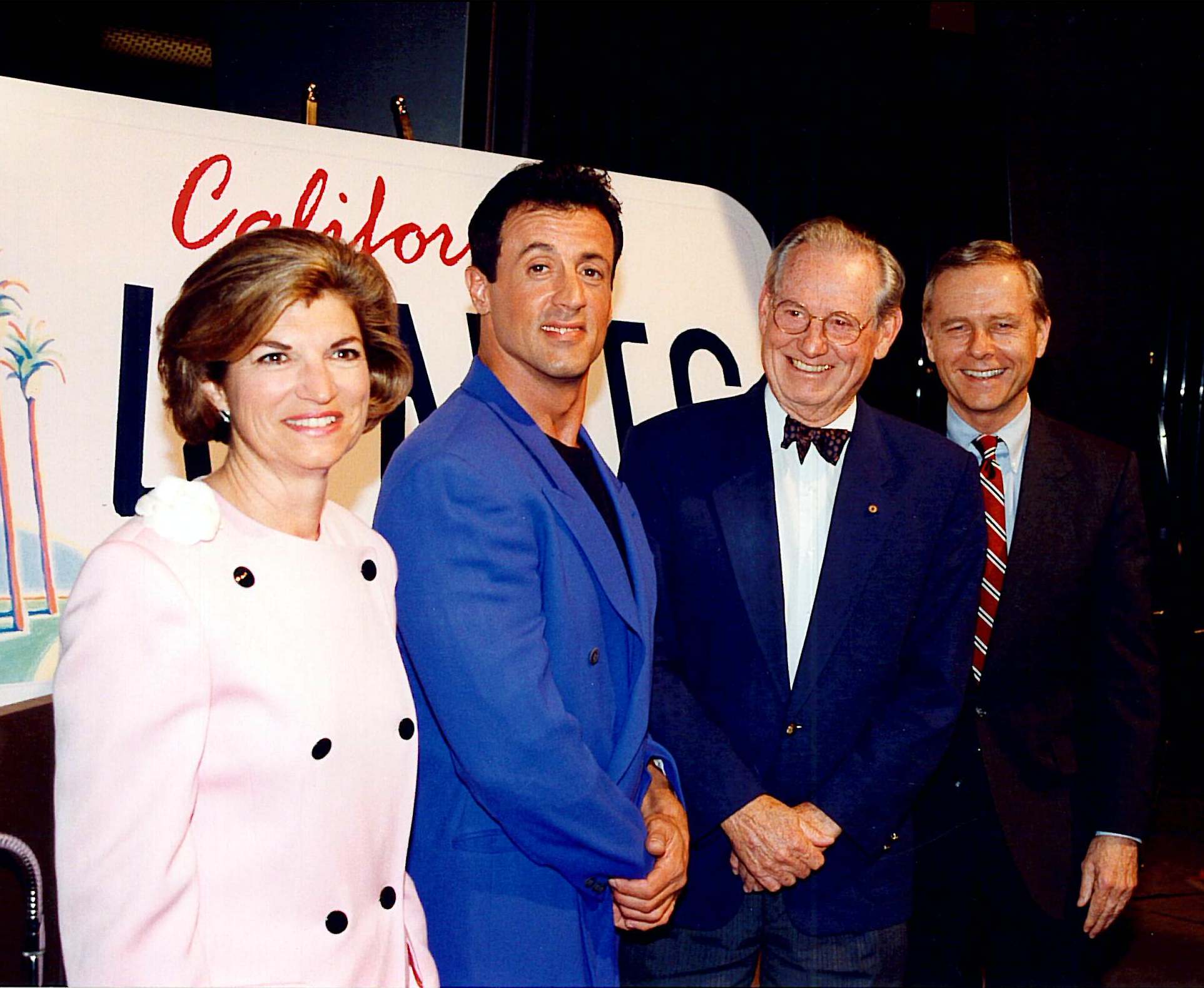 Joanne KozbeRg, THEN-director of the California Arts Council; Sylvester Stallone; Wayne Thiebaud; and Governor Pete Wilson launched the California Arts Plate program on April 29, 1993 at the Warner Bros. Studios in Burbank.