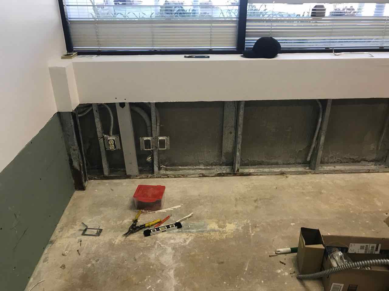 Drywall and flooring project for multiple tenants in office building.