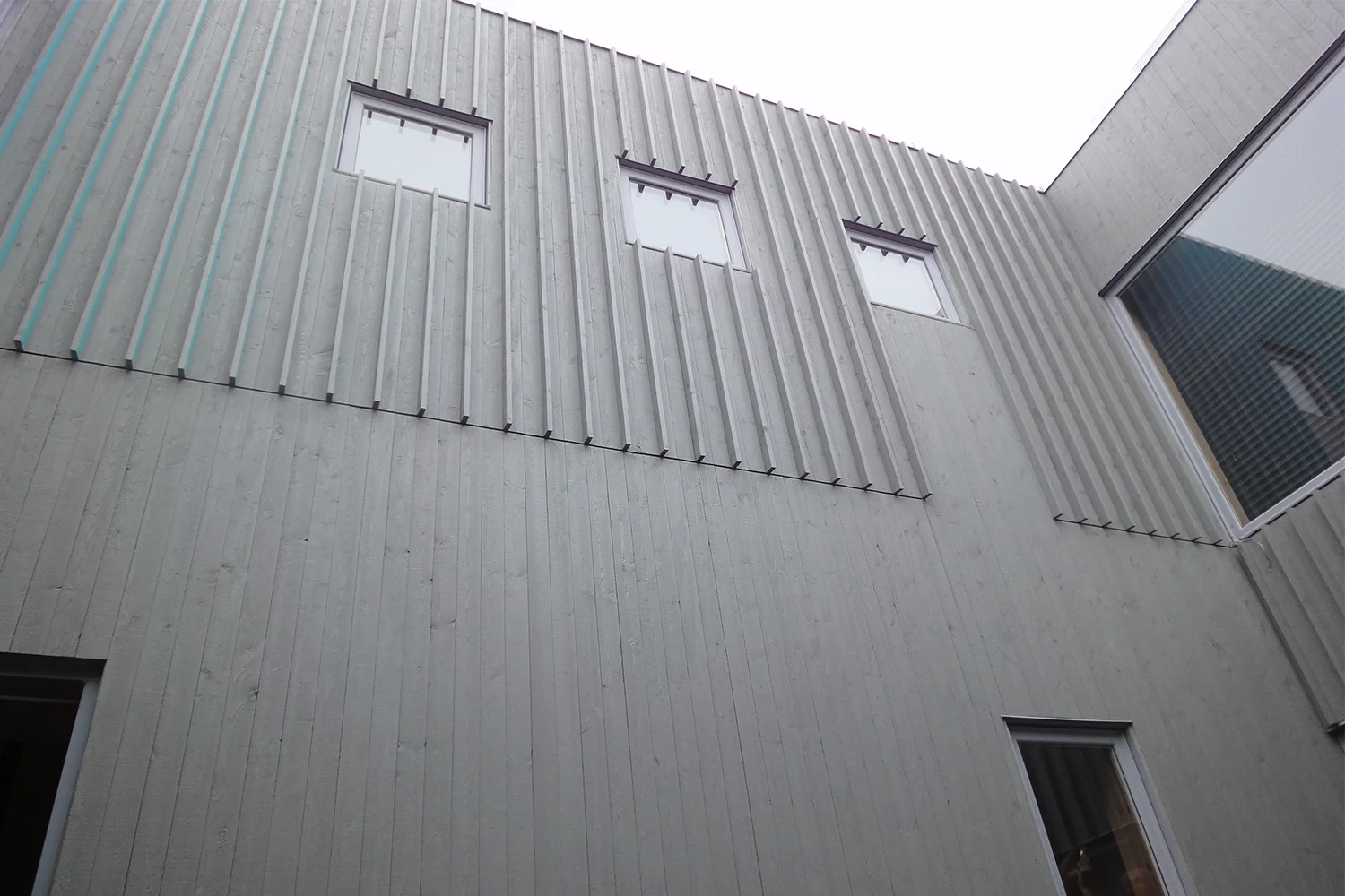 Detail of the exterior wood siding. Board and batten modern.