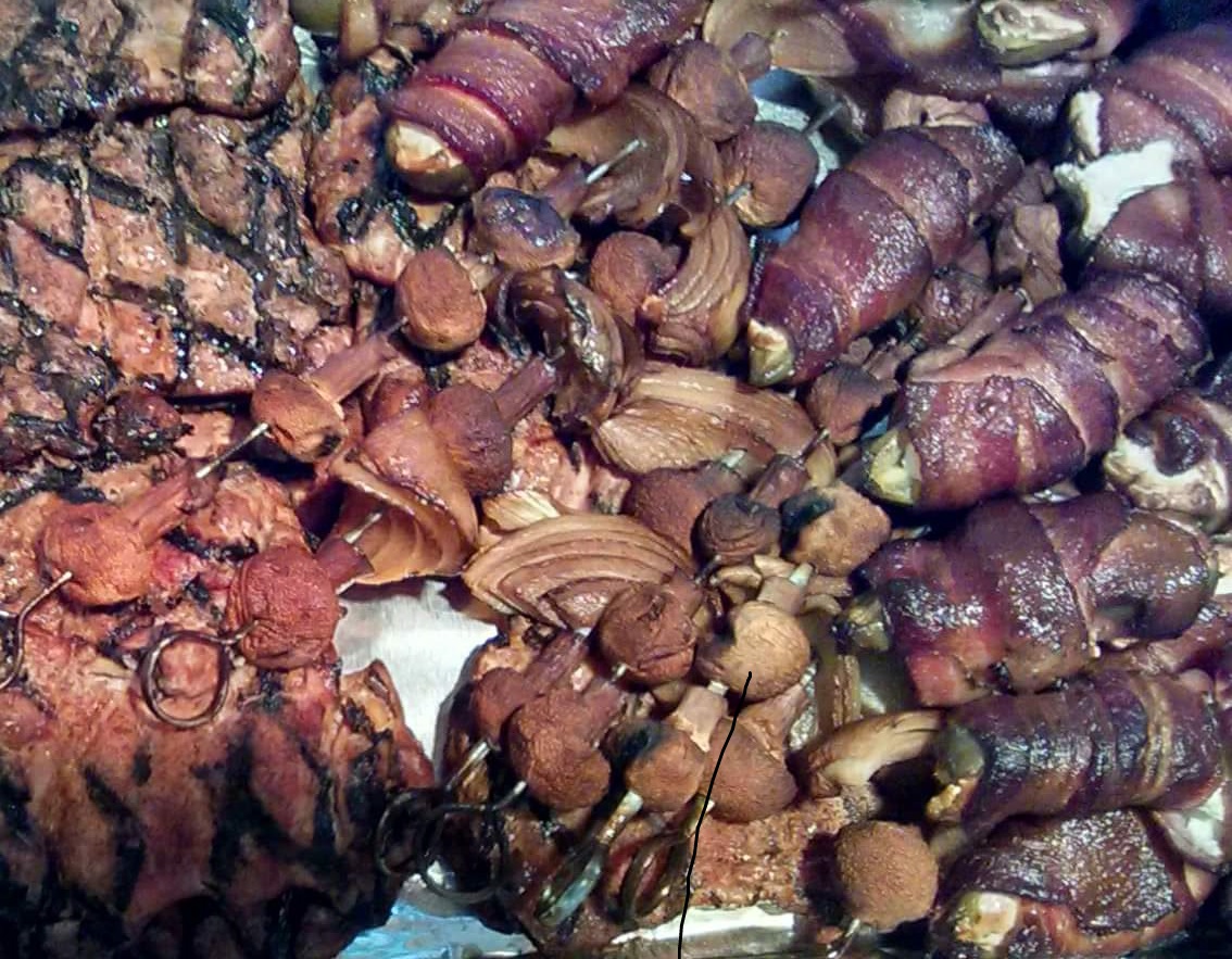 Bacon wrapped, chevre filled jalapenos, mushroom and onion skewers, and chicken breasts- all produced locally or on our ranch. A sample of my lovey's BBQ skills!