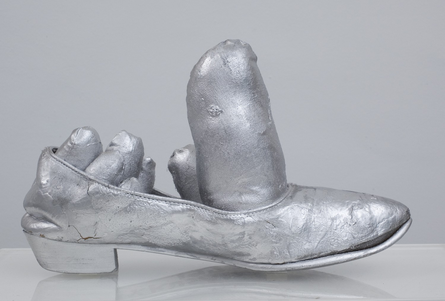  Yayoi Kusama,  Untitled (Silver Soft Shoe Sculpture) , 1976, Shoe, cotton and acrylic paint, 26 x 9 x 26 cm, Signed and dated on underneath 