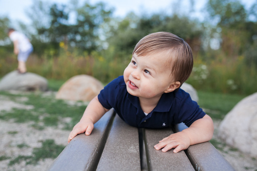 Boy climbing on bench - Rochester MI child photographer