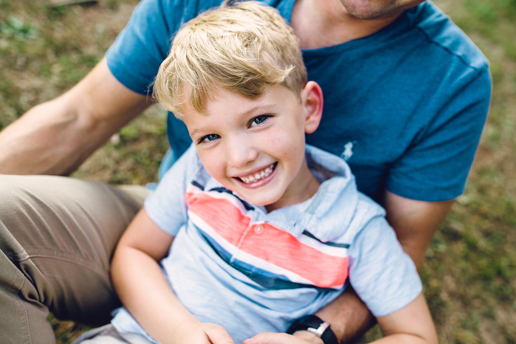 Child Photography Metro Detroit Child sitting on dad's lap