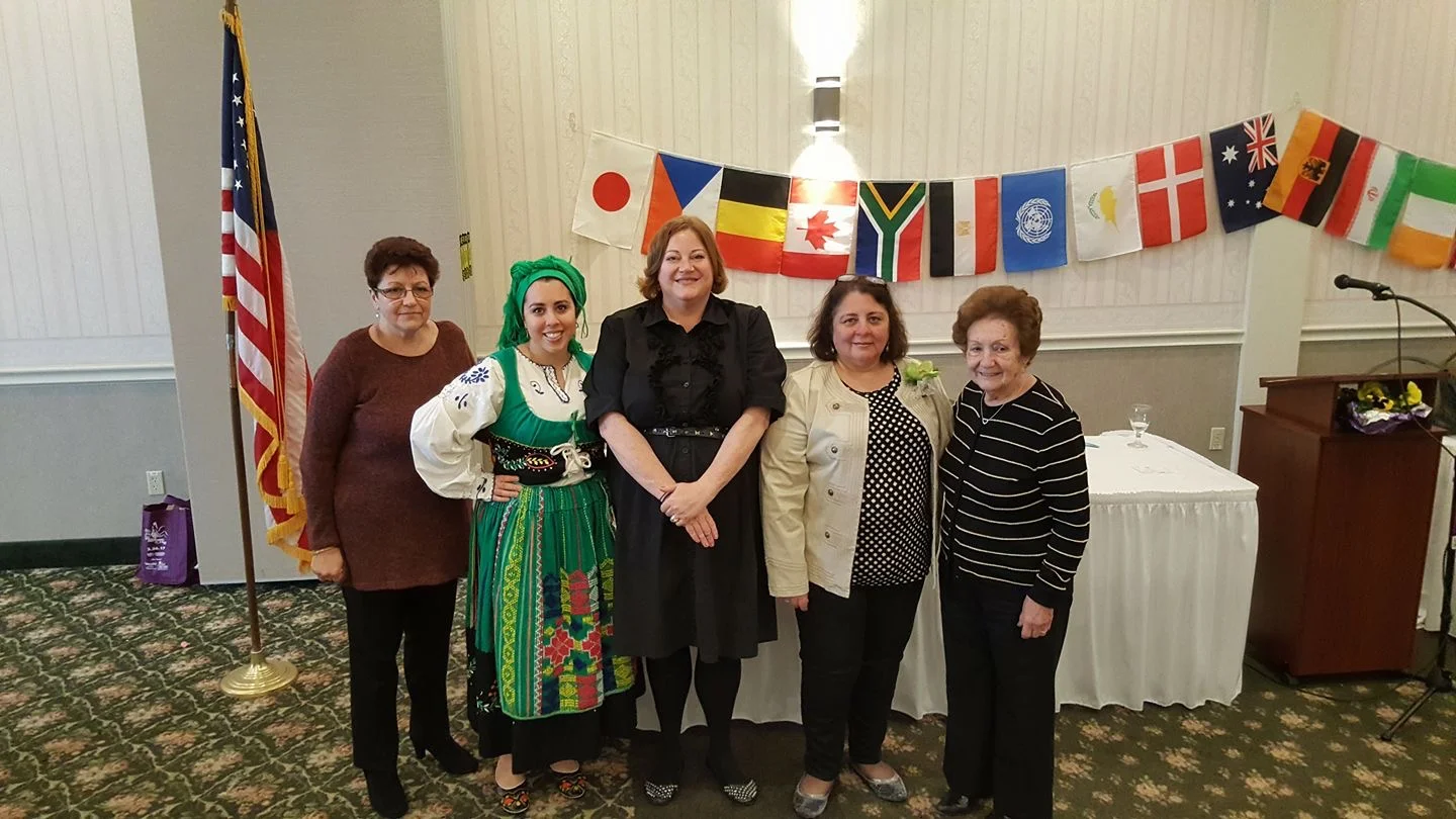 Ana Ferreira in traditional folk dance attire from Portugal surronded by her family. Thanks to you and mom, Christina Melhor for participating in District 11 World Affairs on April 1st.