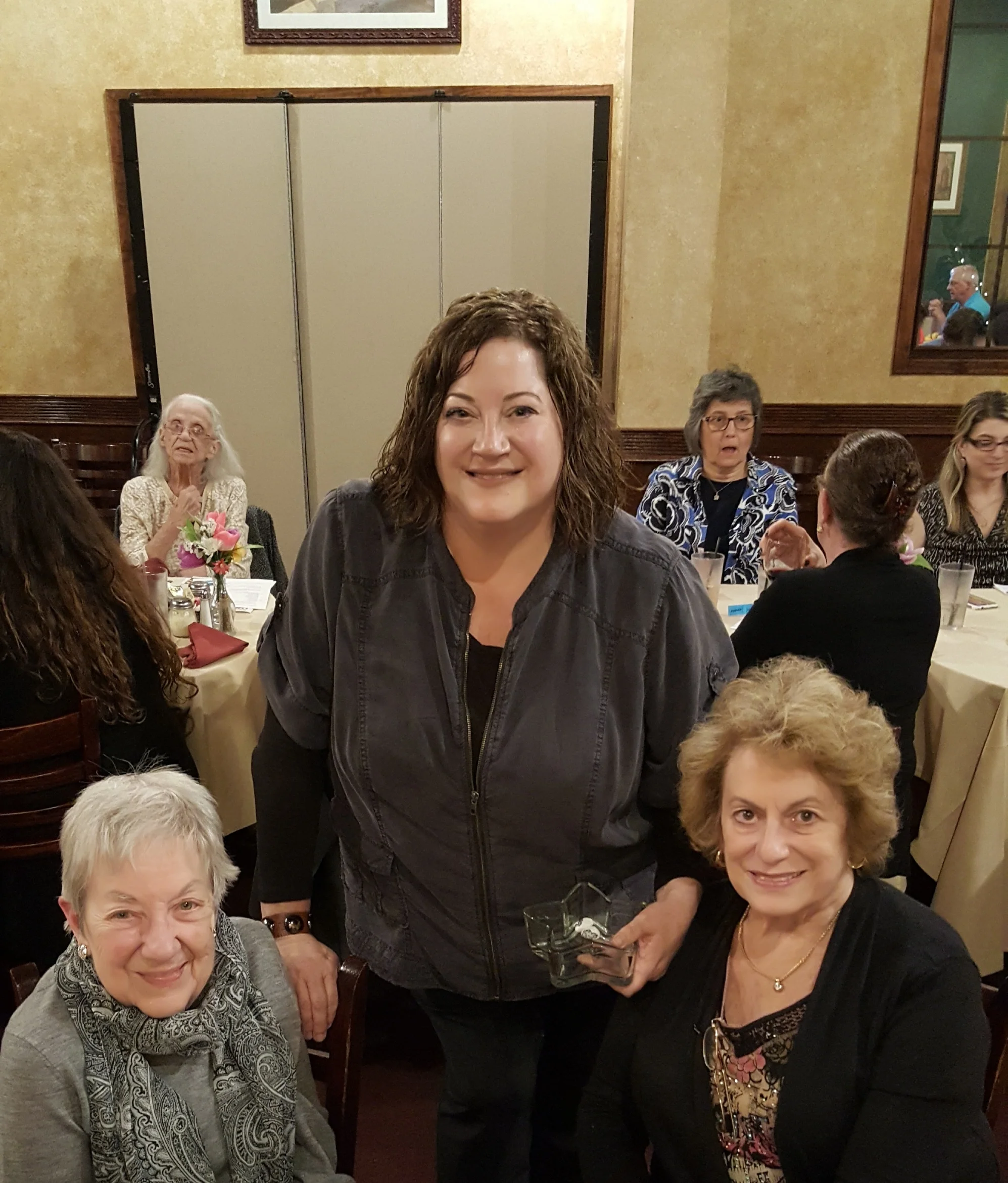 Rockstars of the month get rock candy and mini Nike statues. The winged goddess of victory is BPW's national symbol since 1919. President Becky Shoulberg gives the awards to her mom, Molly Shoulberg (right) and her Aunt Barbara Cressman. The sisters grew up on Forrest Avenue accross from Selma Mansion.