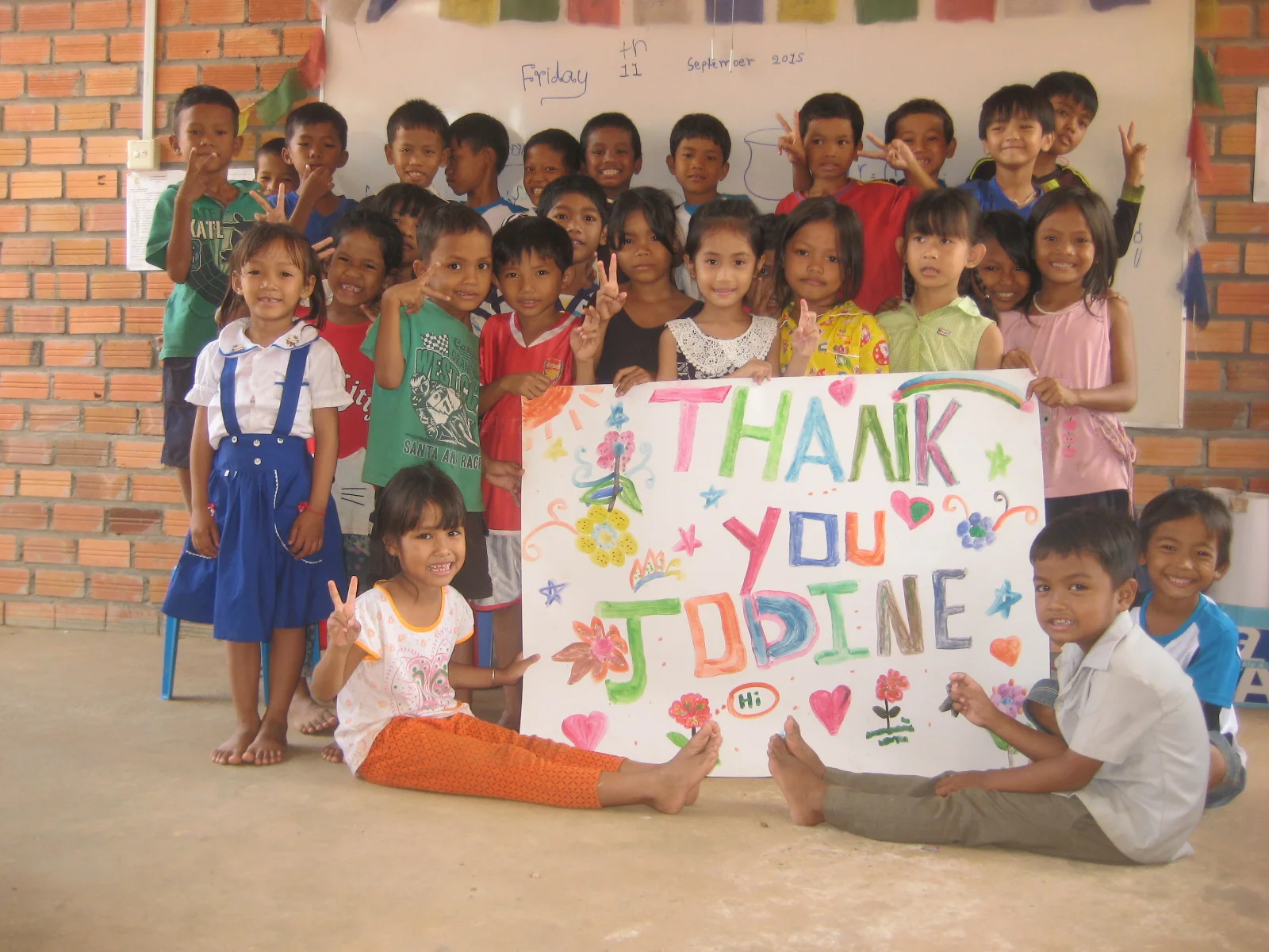 Jodiine received this poster from the kids she helped to educated and feed.