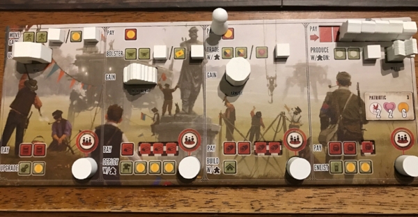 The pairings of top and bottom row actions made a way bigger difference than I anticipated in the game. Red icons are costs, green are rewards. As you resolve the "upgrade" action, cubes uncover more green icons and can cover up red costs.