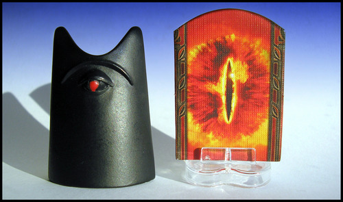 The Reiner Knizia co-op classic "The Lord of the Rings" features my favorite game piece of all time (left), a wooden obelisk abstraction of barad-dur. This rad piece has some serious heft, but it was woefully replaced with a terrible standee in later Fantasy Flight Games releases (boo!)