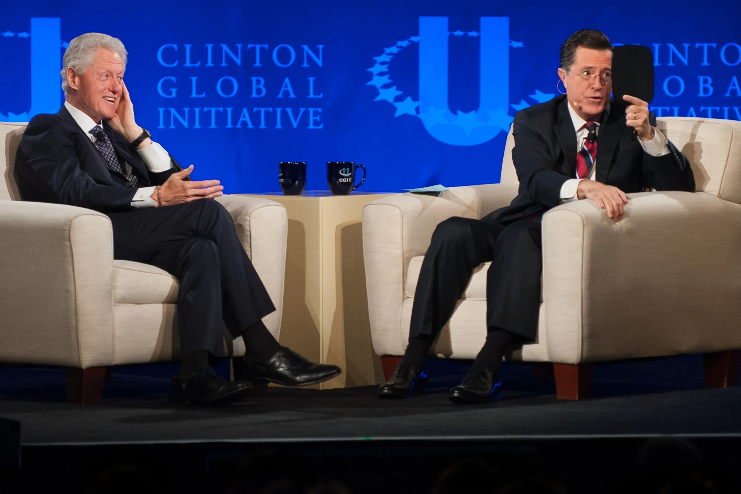 Stephen Colbert interviews former President Bill Clinton during the Clinton Global Initiative University meeting at Washington University