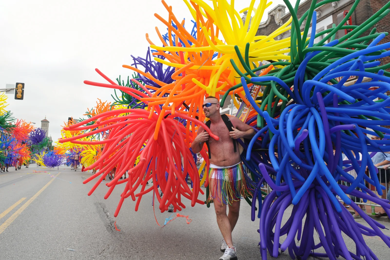 Terry Laupp of the St. Louis Balloon Brigade marches in the Pridefest St. Louis parade