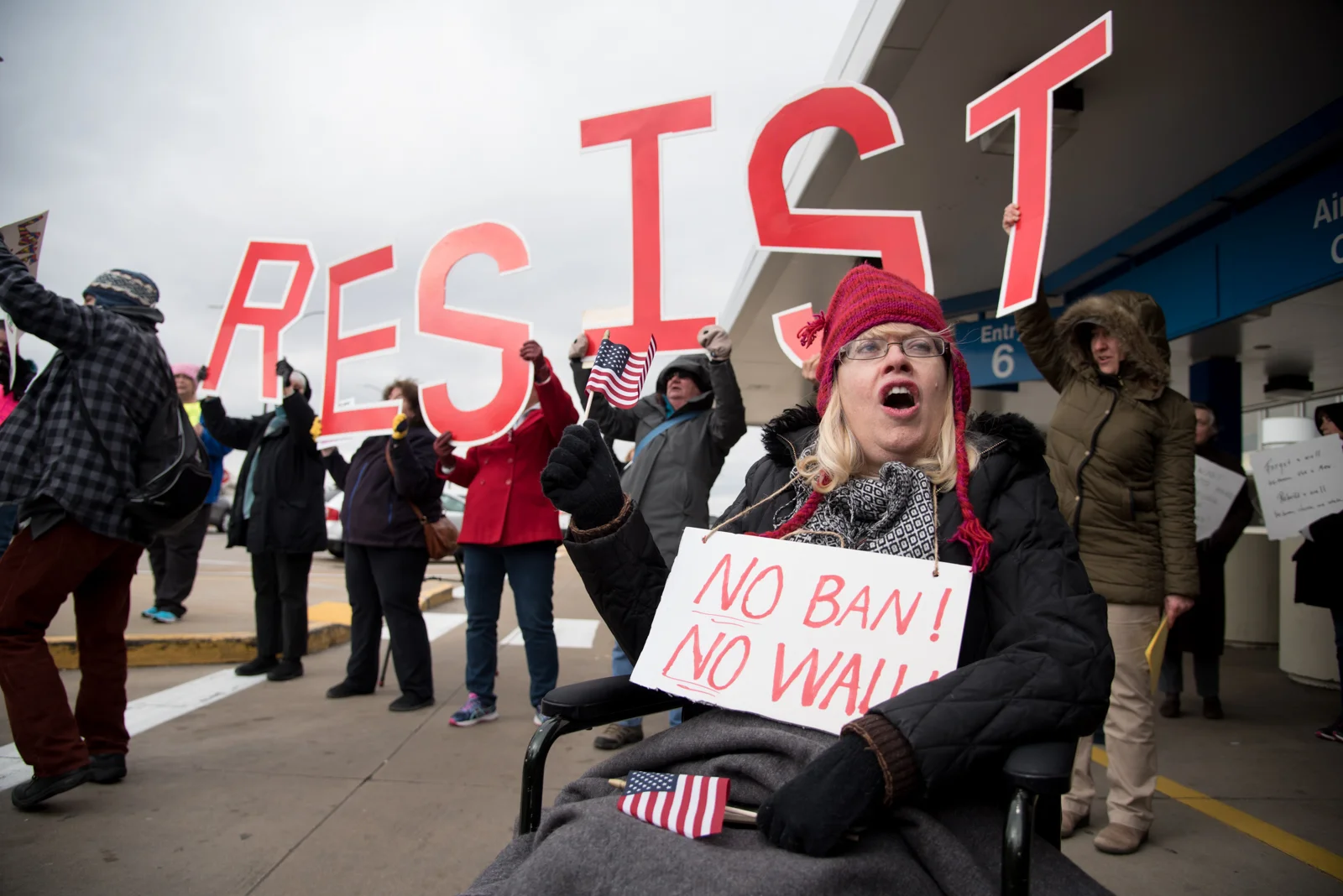 Protesters rally outside St. Louis Lambert International Airport against President Trump's immigration policies