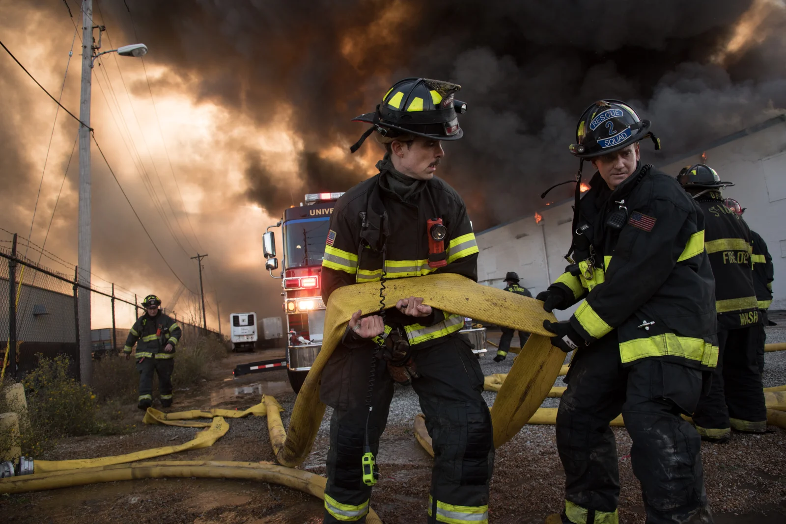 Members of the St. Louis Fire Department fight a five-alarm fire at Park Warehouse Services in the Botanical Heights neighborhood of St. Louis